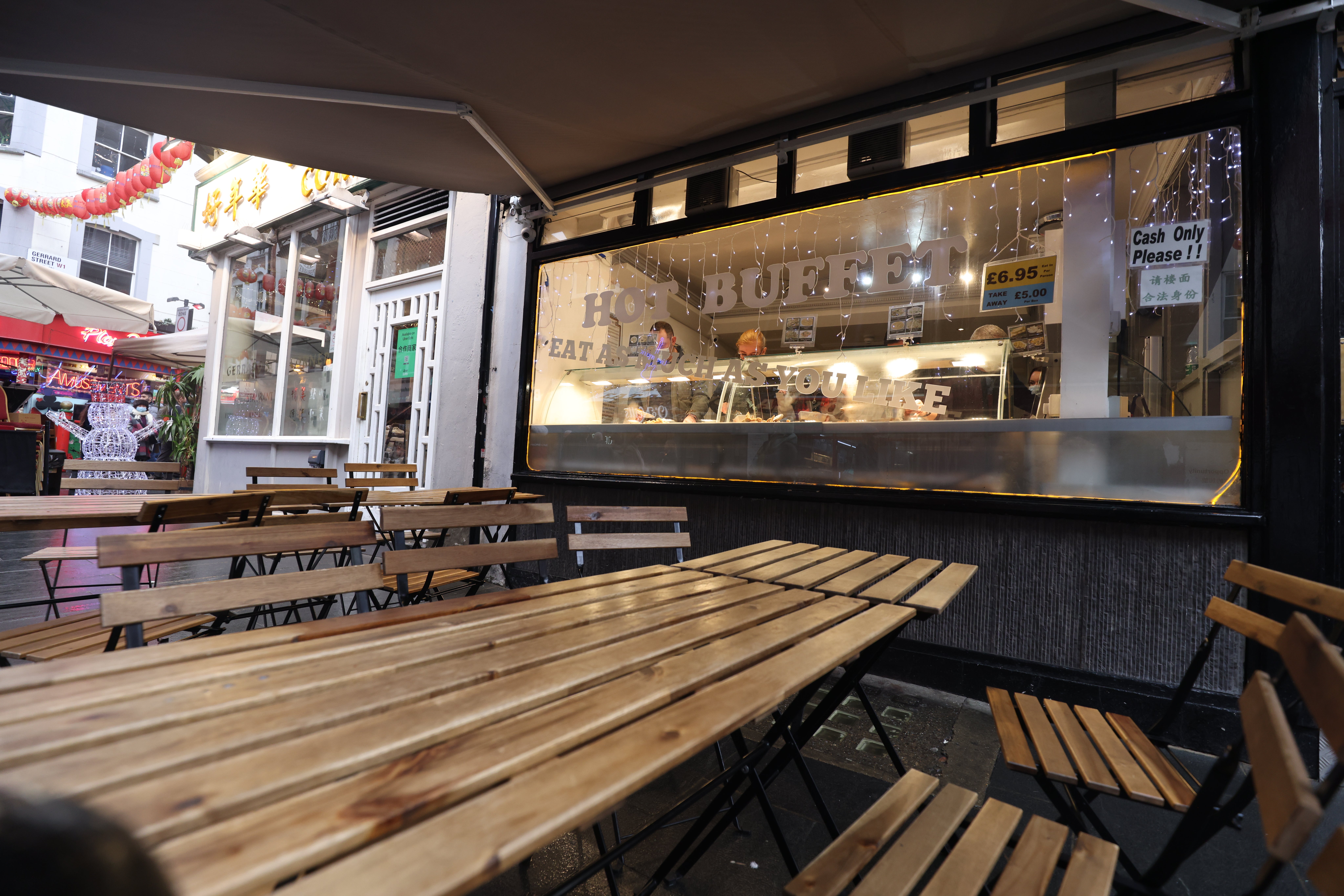 Empty tables and chairs outside a restaurant in Soho, central London, on December 29 (James Manning/PA)
