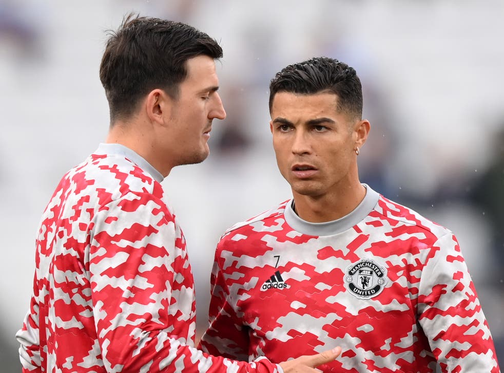 <p>Manchester United captain Harry Maguire with Cristiano Ronaldo</p>