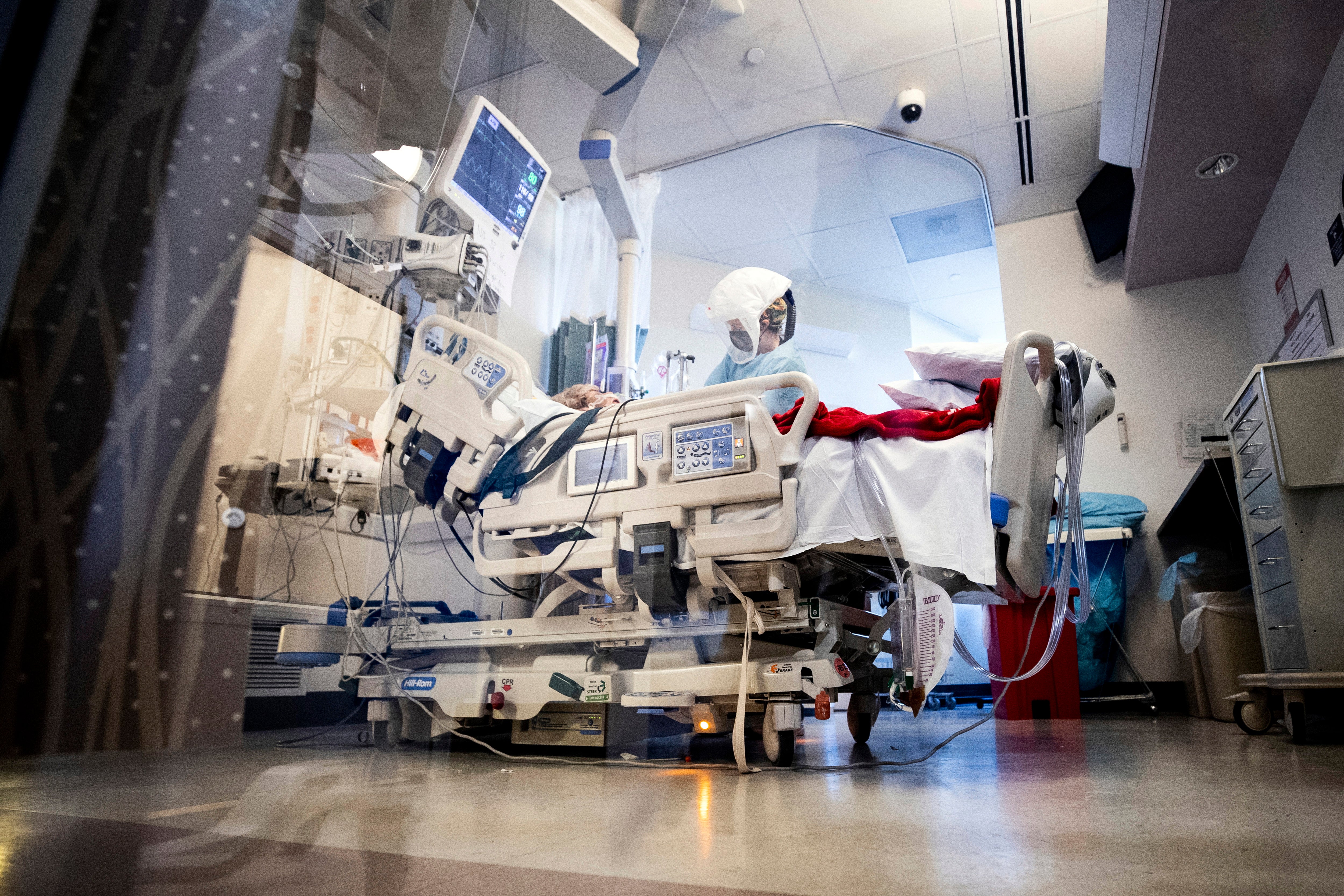 A nurse treats a Covid-19 patient in the ICU of the Sharp Grossmont Hospital amid the coronavirus pandemic in La Mesa, East of San Diego, California, USA, 11 January 2022. The number of patients, who contracted the coronavirus, exploded in the recent weeks and US hospitals reportedly are currently caring for the highest number of patients since the beginning of the pandemic. EPA/ETIENNE LAURENT ATTENTION: This Image is part of a PHOTO SET