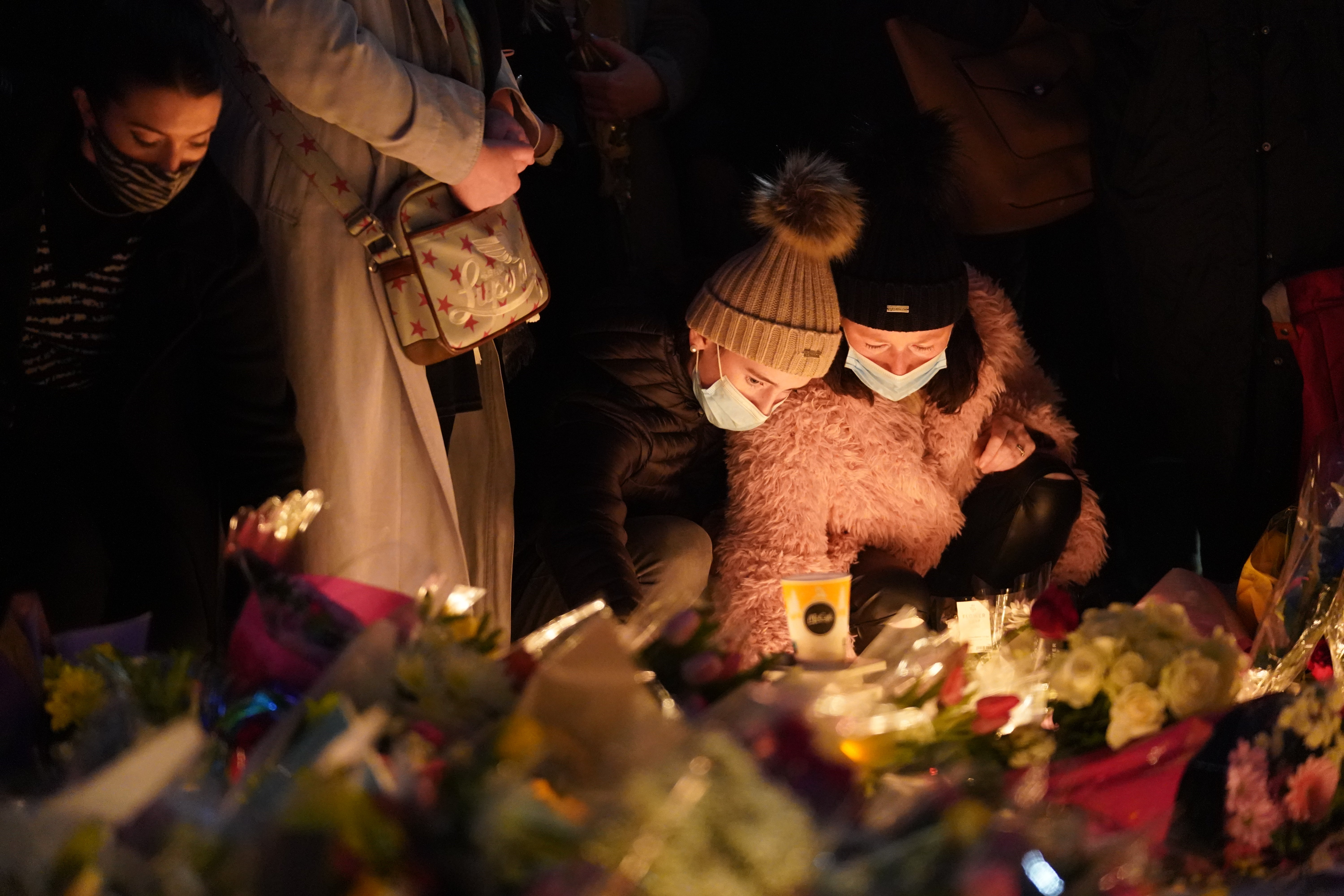 Candles are lit at a makeshift shrine at Leinster House, Dublin (Brian Lawless/PA)