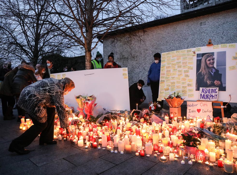 Local people light candles after a vigil in memory of Aisling Murphy (Damien Eagers/PA Wire)