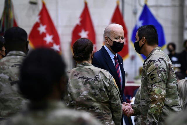 <p>US President Joe Biden greets soldiers at Fort Bragg to mark the upcoming Thanksgiving holiday on November 22, 2021, in Fort Bragg, North Carolina. </p>