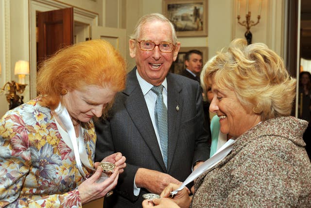 Lord Sainsbury laughs as Dr Carol Hogel CBE (left) and Dame Vivien Duffield CBE, study their Prince of Wales Medals for Arts Philanthropy at Clarence House in central London. (John Stillwell/PA)
