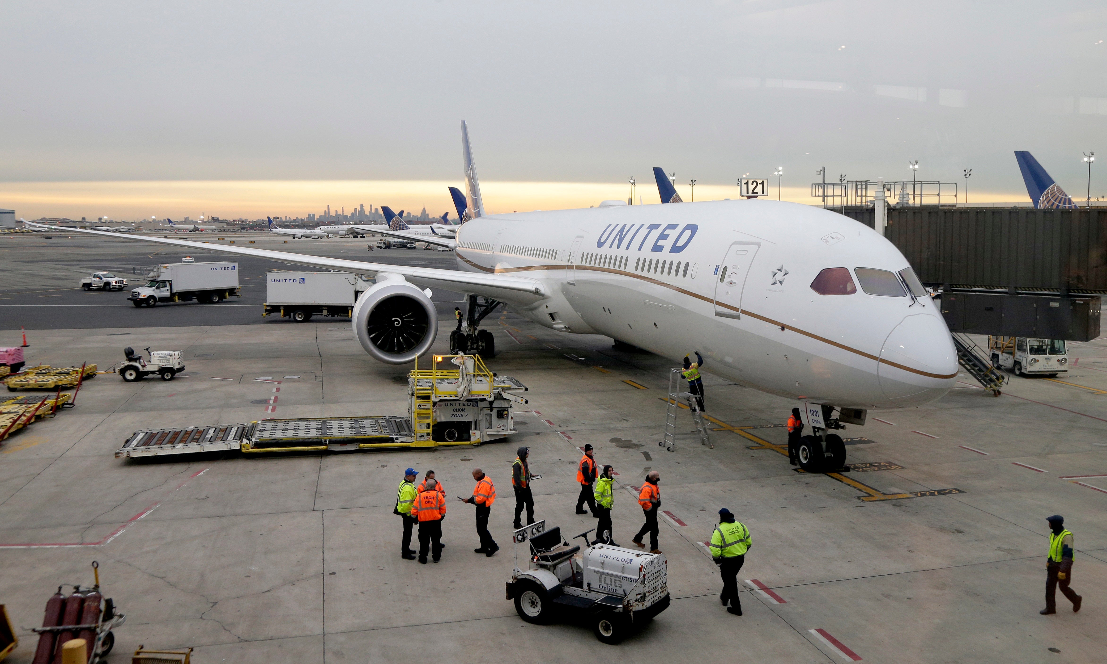 A Dreamliner 787-10 arriving from Los Angeles pulls up to a gate at Newark Liberty International Airport in Newark, N.J., Monday, Jan. 7, 2019. Federal safety officials are directing operators of some Boeing planes to adopt extra procedures when landing on wet or snowy runways near impending 5G service because, they say, interference from the wireless networks could mean that the planes need more room to land.