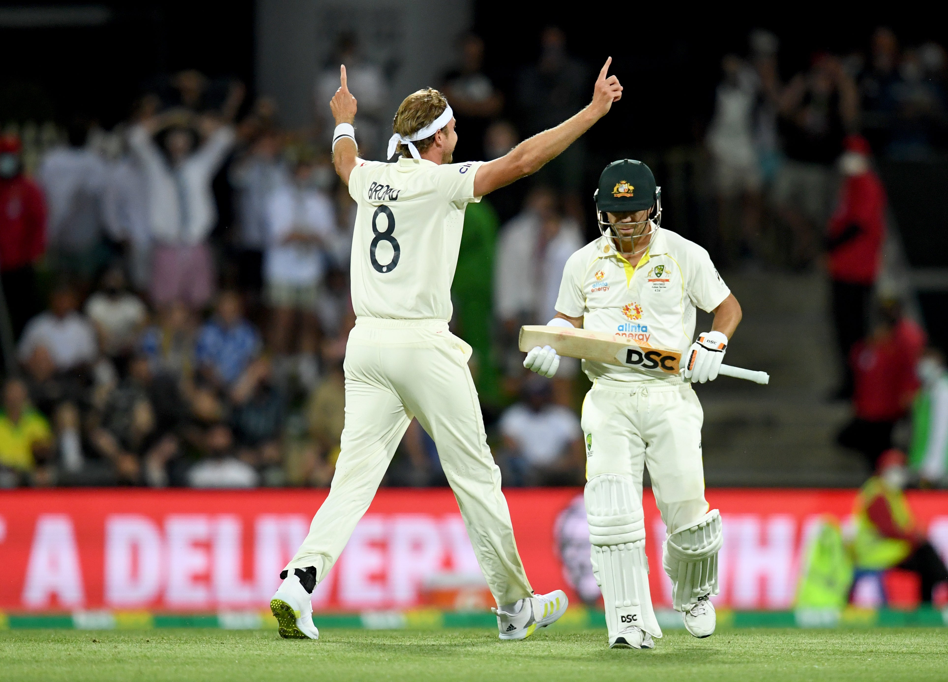 England’s Stuart Broad celebrates the wicket of Australia opener David Warner.