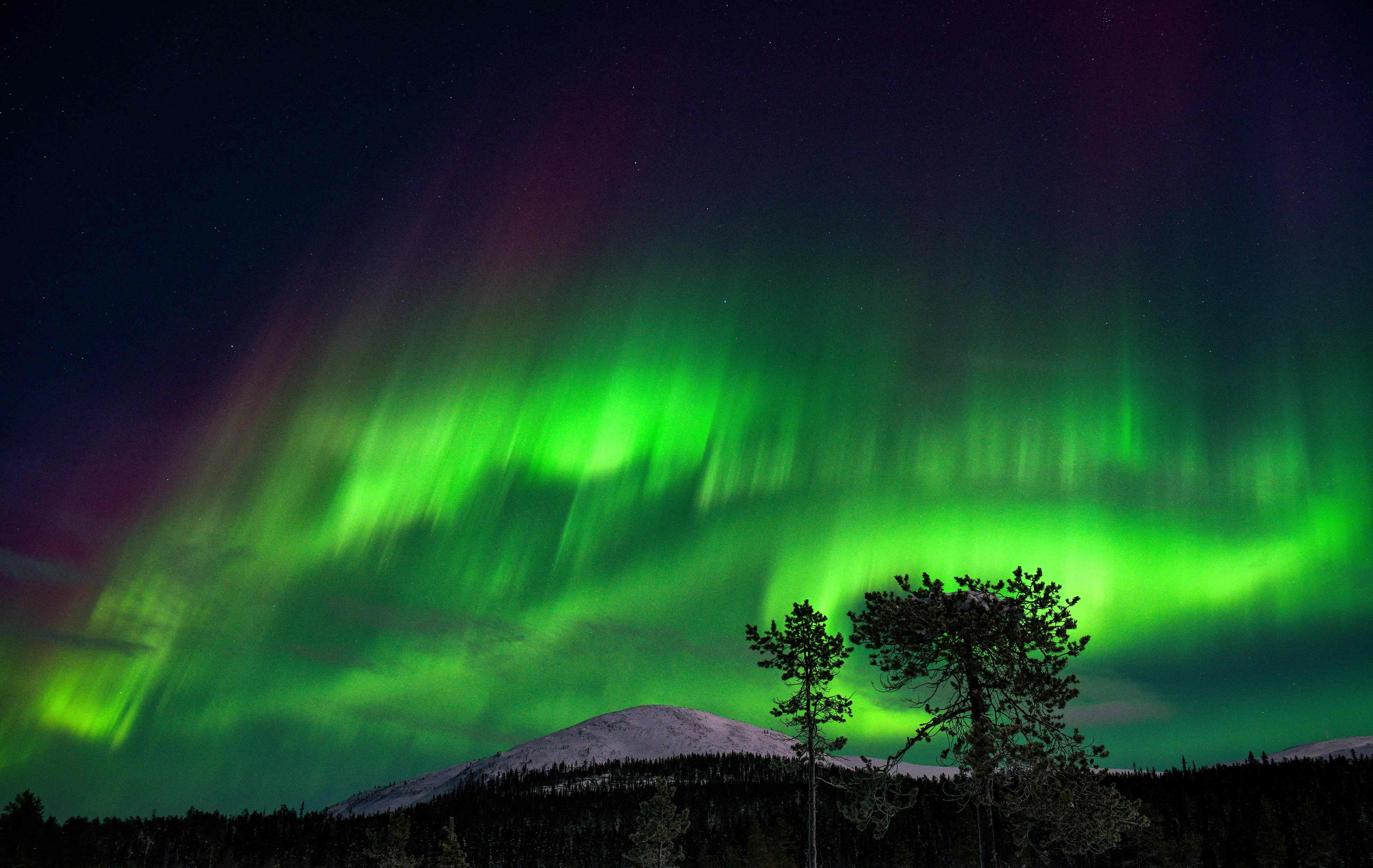 See the lights on snowmobiles or reindeer-drawn sleighs in Finnish Lapland