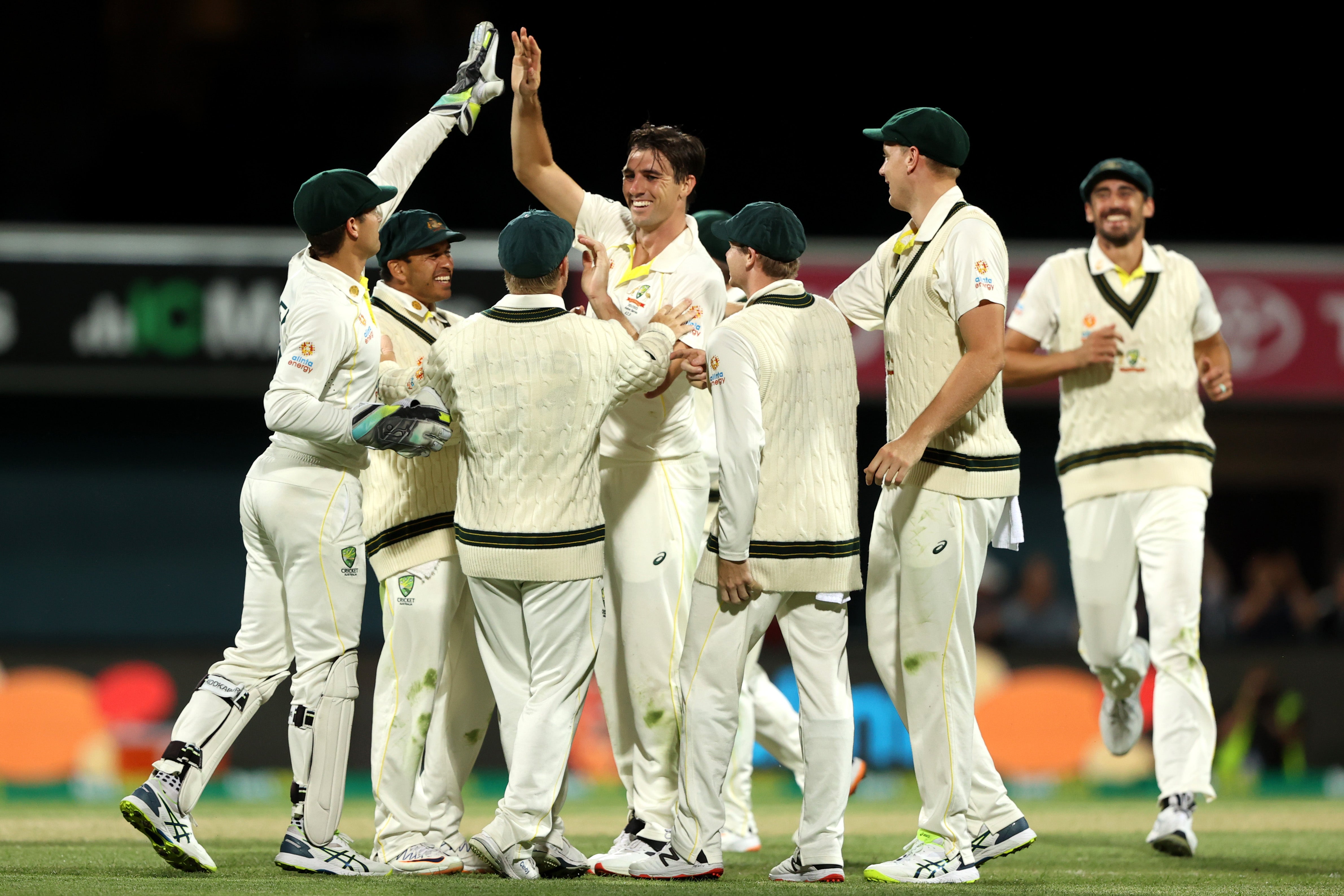 Pat Cummins of Australia celebrates with teammates in the fifth Test in Hobart