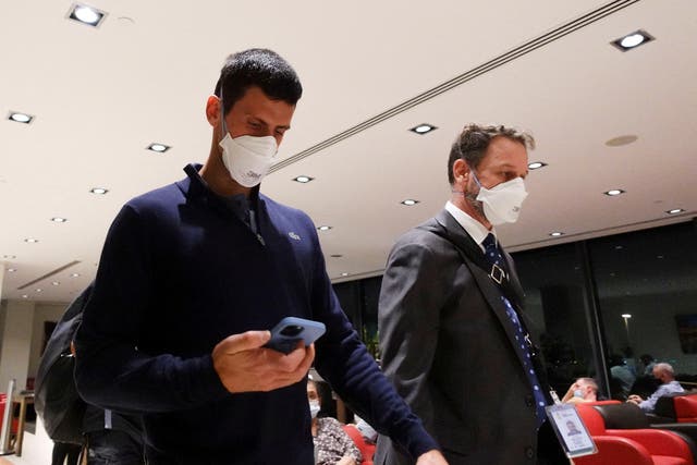 <p>Novak Djokovic walks in Melbourne Airport before boarding a flight</p>