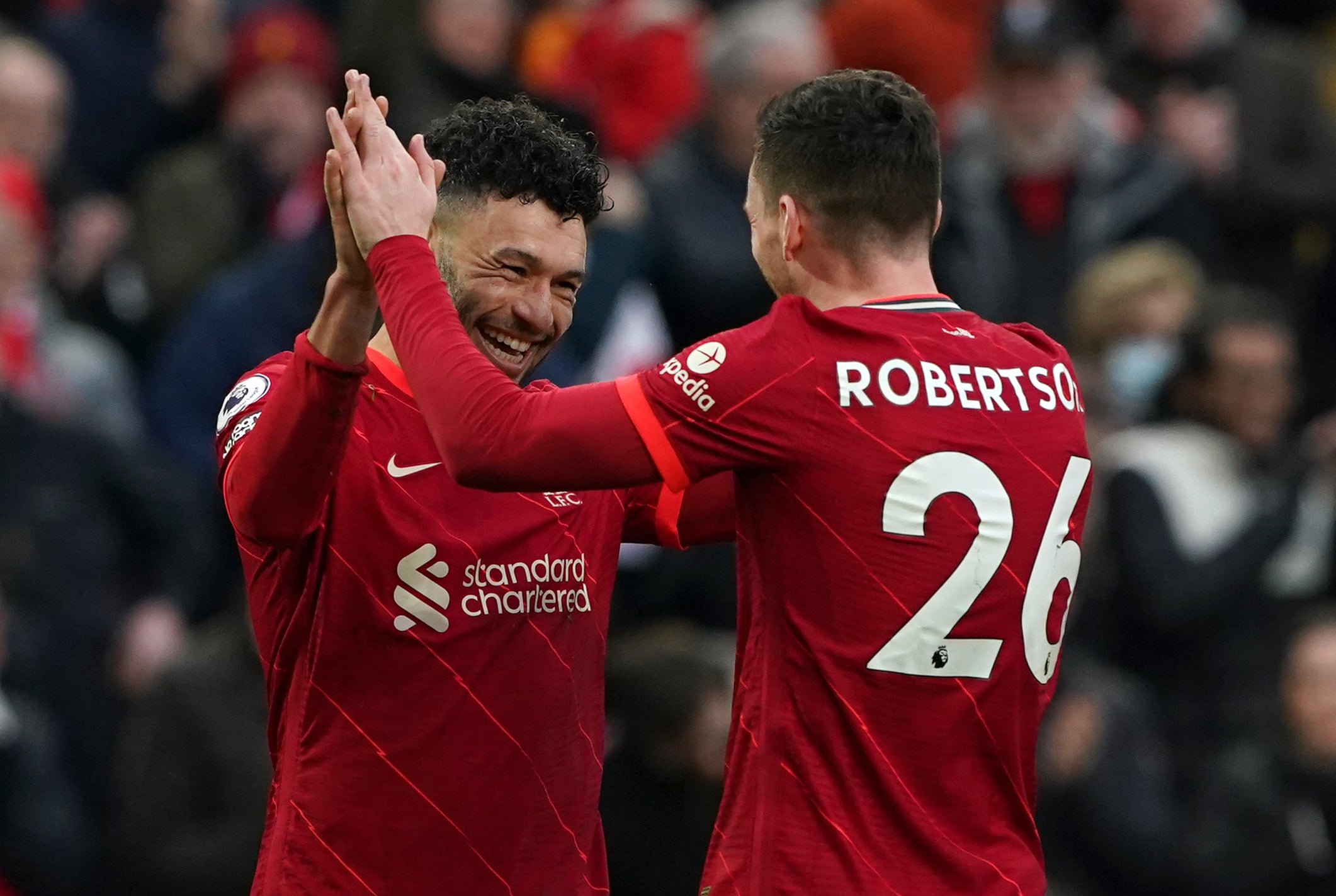 Alex Oxlade-Chamberlain (left) celebrates with Andrew Robertson after scoring in Liverpool’s 3-0 victory over Brentford on Sunday (Peter Byrne/PA)