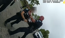 Police officer caught choking colleague who tried to stop him attacking suspect