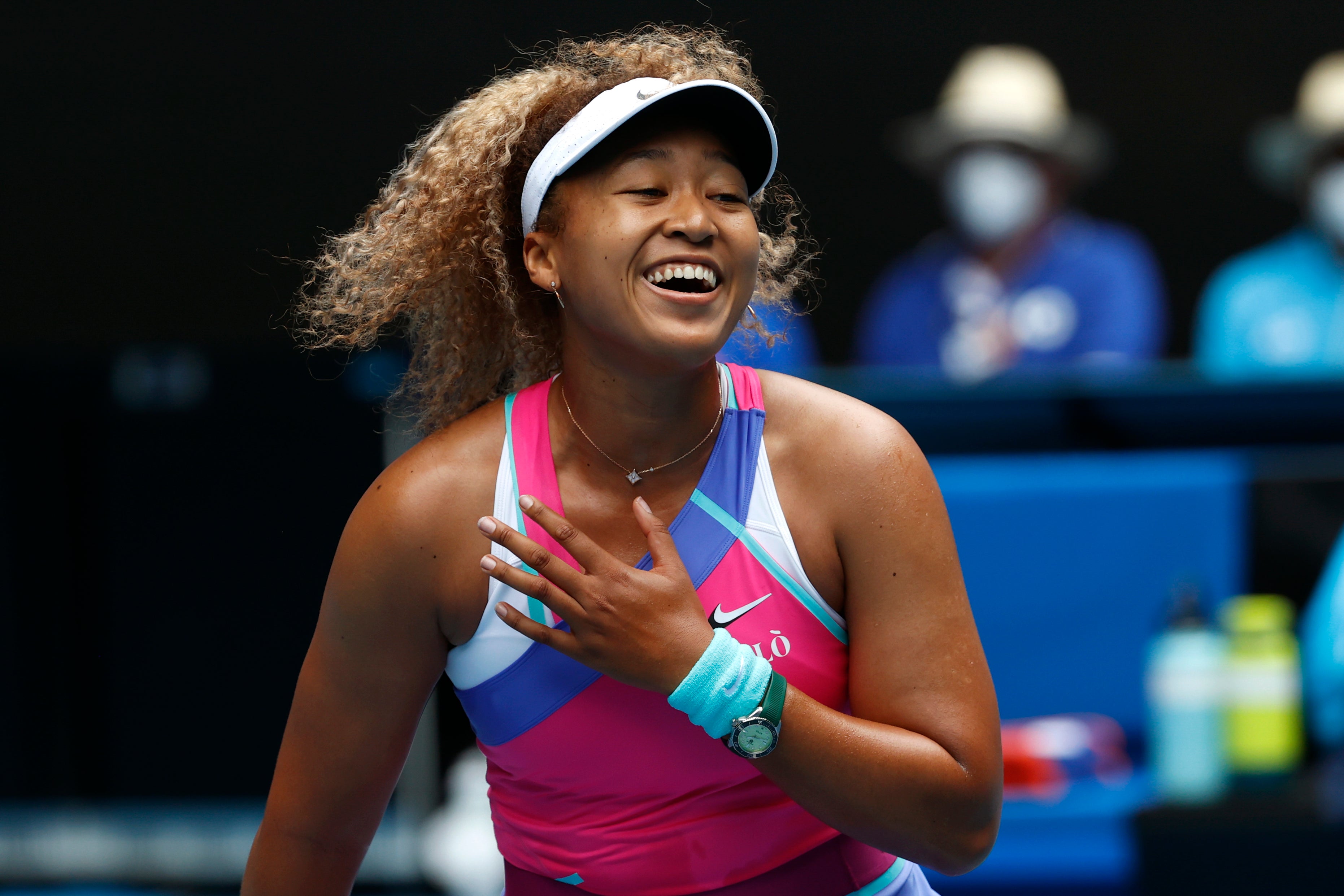 Naomi Osaka laughs during her victory over Camila Osorio (Hamish Blair/AP)