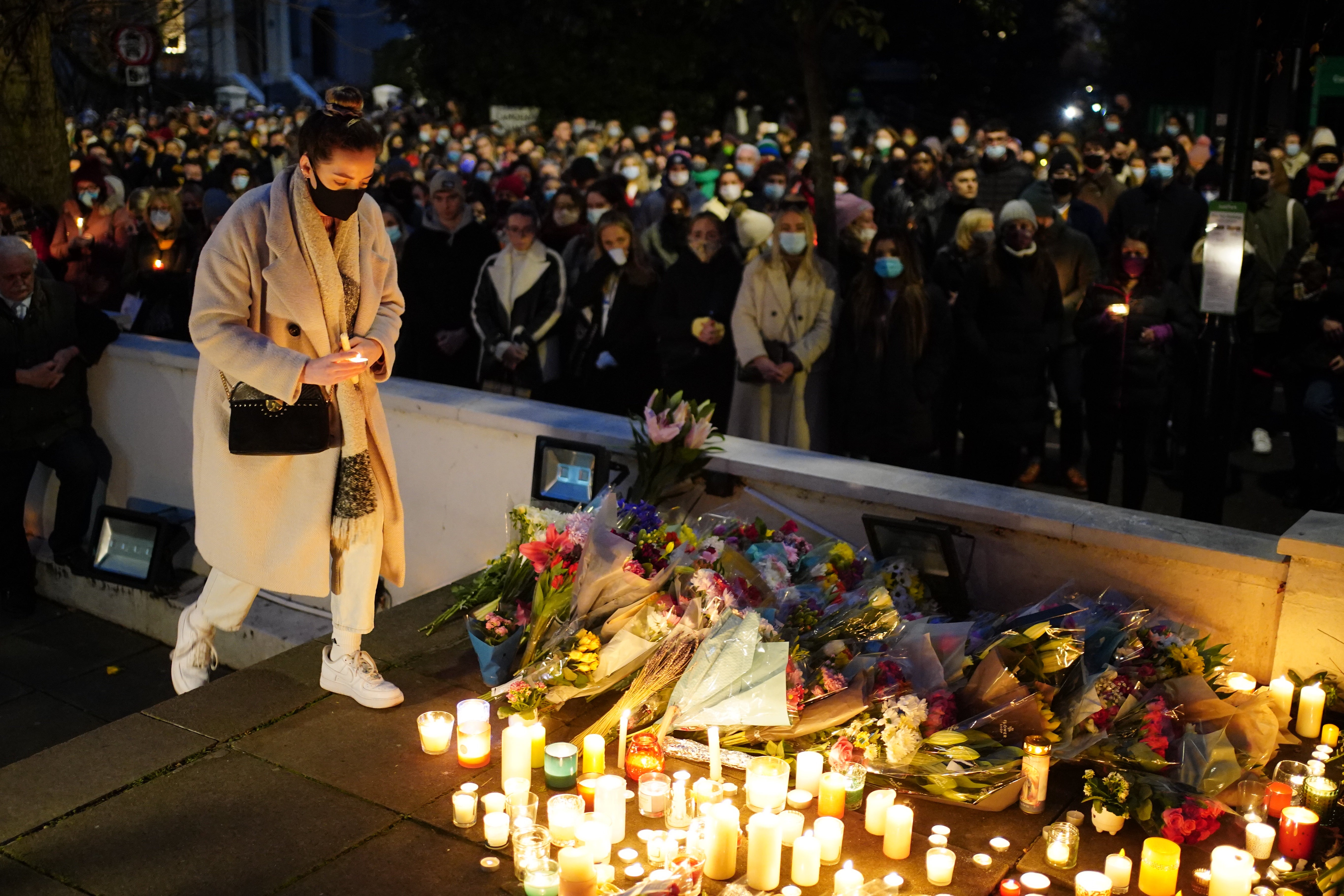 Floral tributes and candles are left for Ms Murphy during a vigil outside the London Irish Centre in Camden (PA)