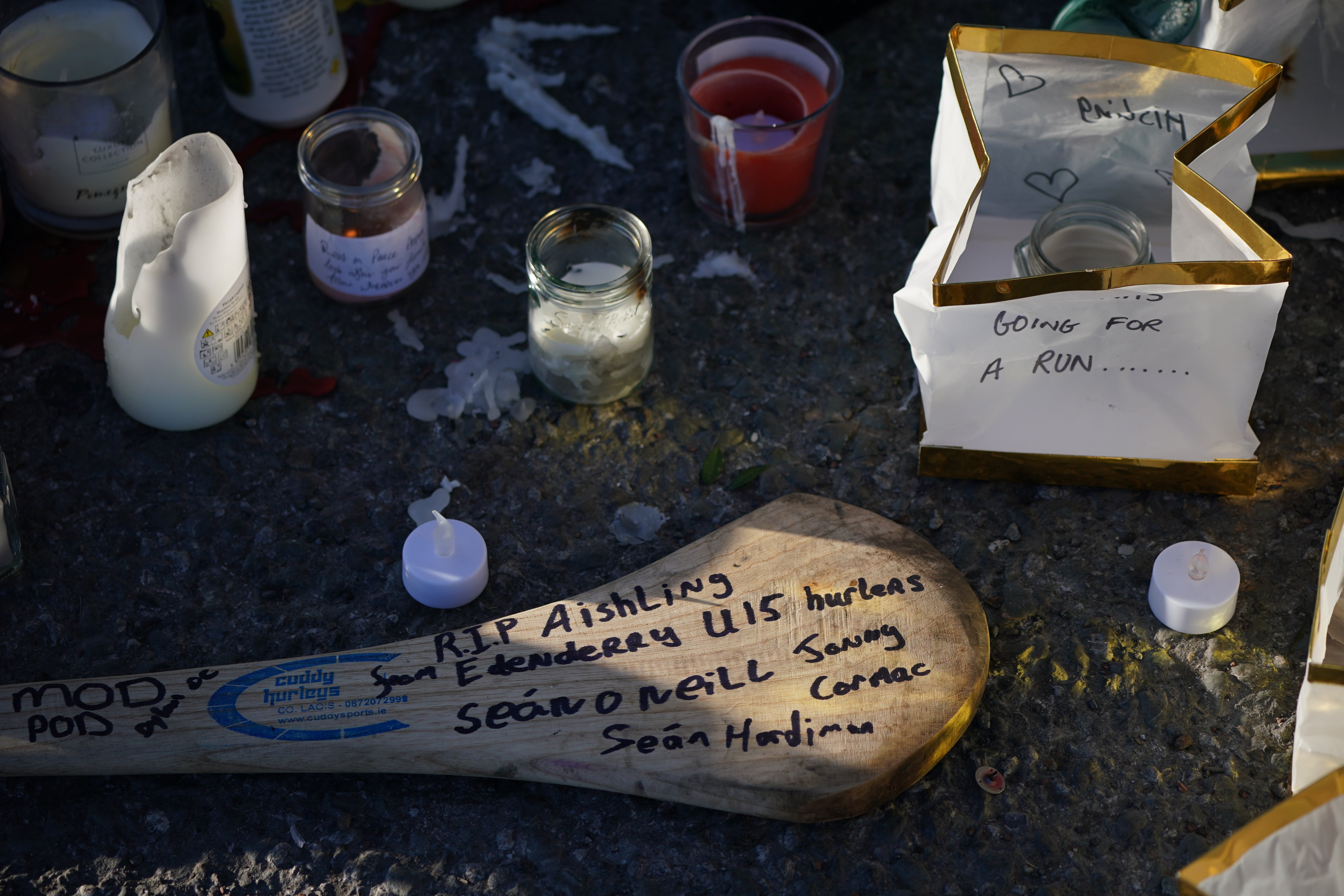 A message left on a hurling stick laid at the Grand Canal in Tullamore, Co Offaly, where Ashling Murphy was found dead. Ms Murphy was a keen camogie player (Niall Carson/PA)