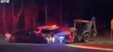 Dramatic video shows police fatally shoot man who was driving a backhoe into homes and cars