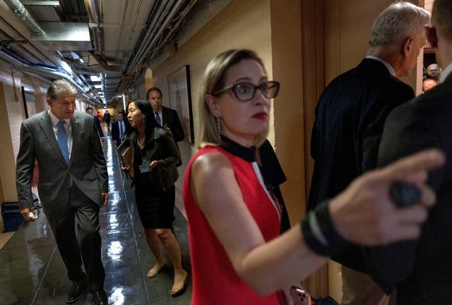 <p>Sens Kyrsten Sinema and Joe Manchin at the US Capitol</p>