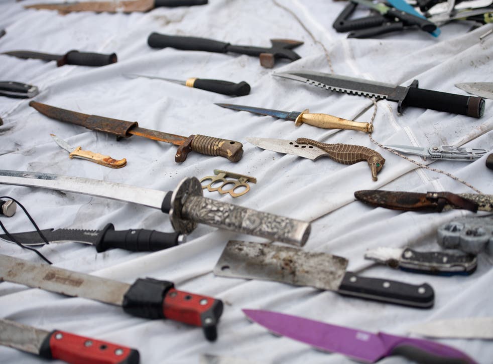 Knives and other weapons that were deposited into weapon surrender bins (Jacob King/PA)