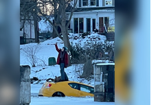 Woman takes selfie on top of her car as it sinks into icy river and rescuers rush to save her in Canada