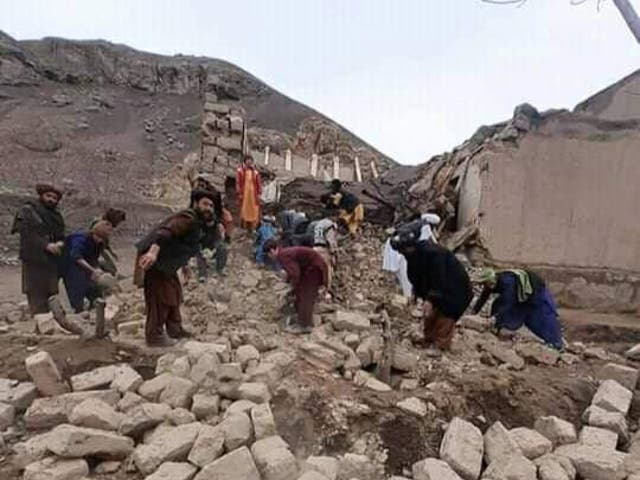 <p>Rescue workers look through debris in the aftermath of two successive earthquakes in Badghis province of Afghanistan </p>