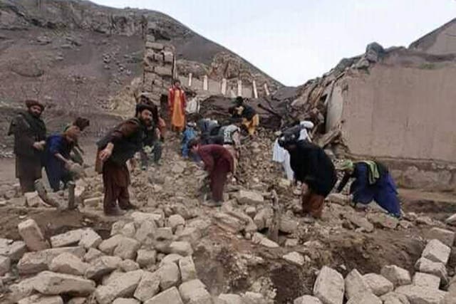 <p>Rescue workers look through debris in the aftermath of two successive earthquakes in Badghis province of Afghanistan </p>