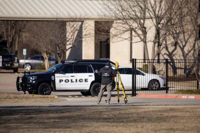 <p>Police process the scene in front of the Congregation Beth Israel synagogue in Colleyville, Texaswhere Malik Faisal Akram was shot dead by the FBI </p>