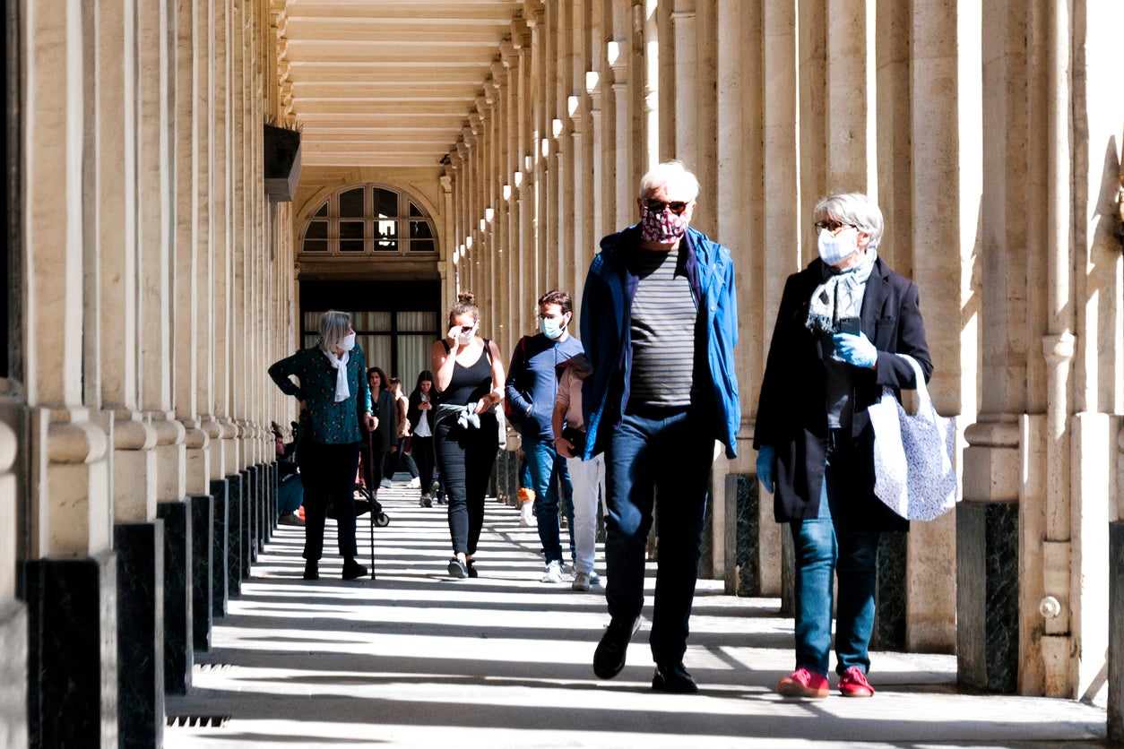 Masked tourists near Palais Royal, Paris