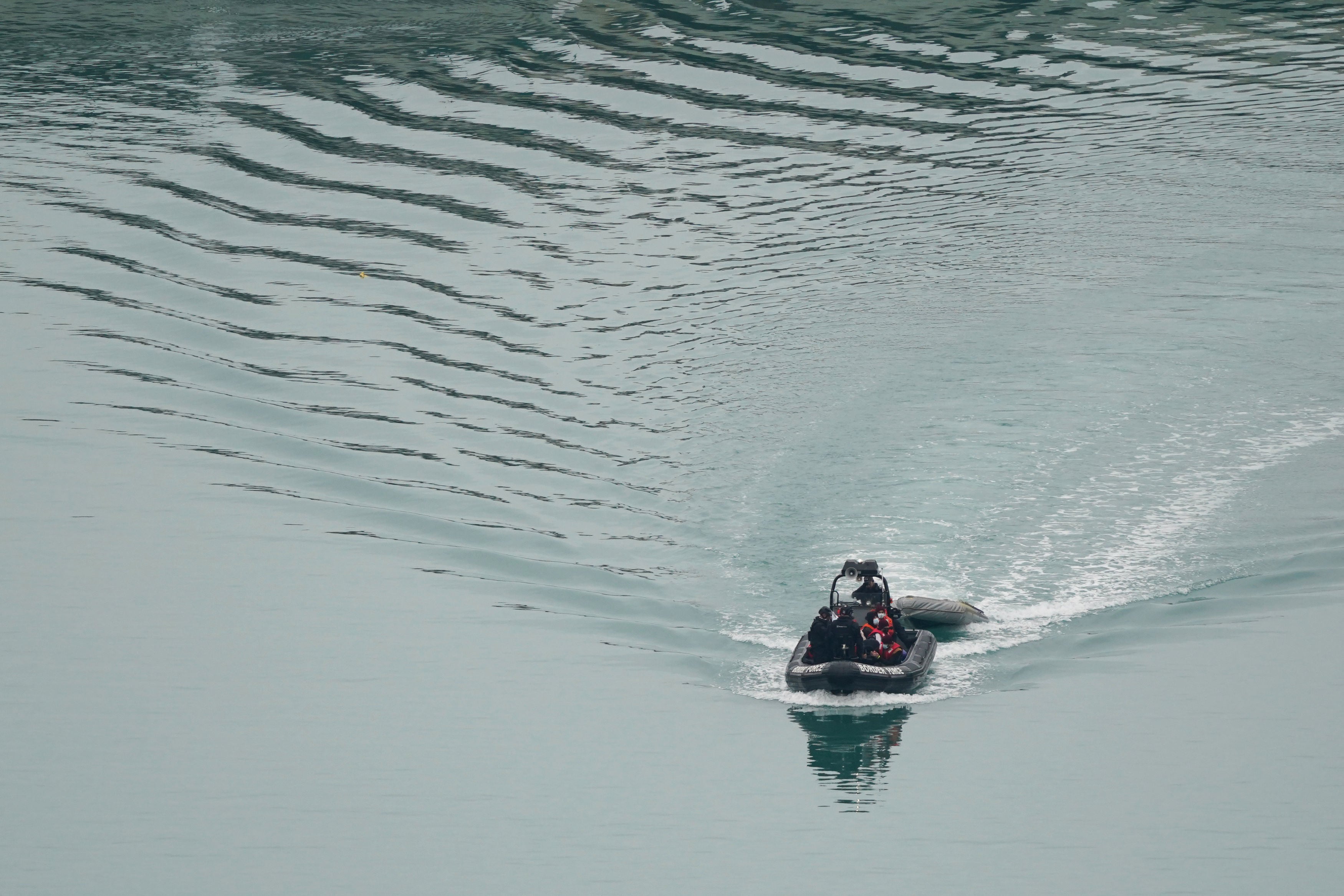 A group of people thought to be migrants being brought in to Dover, Kent (Gareth Fuller/PA)