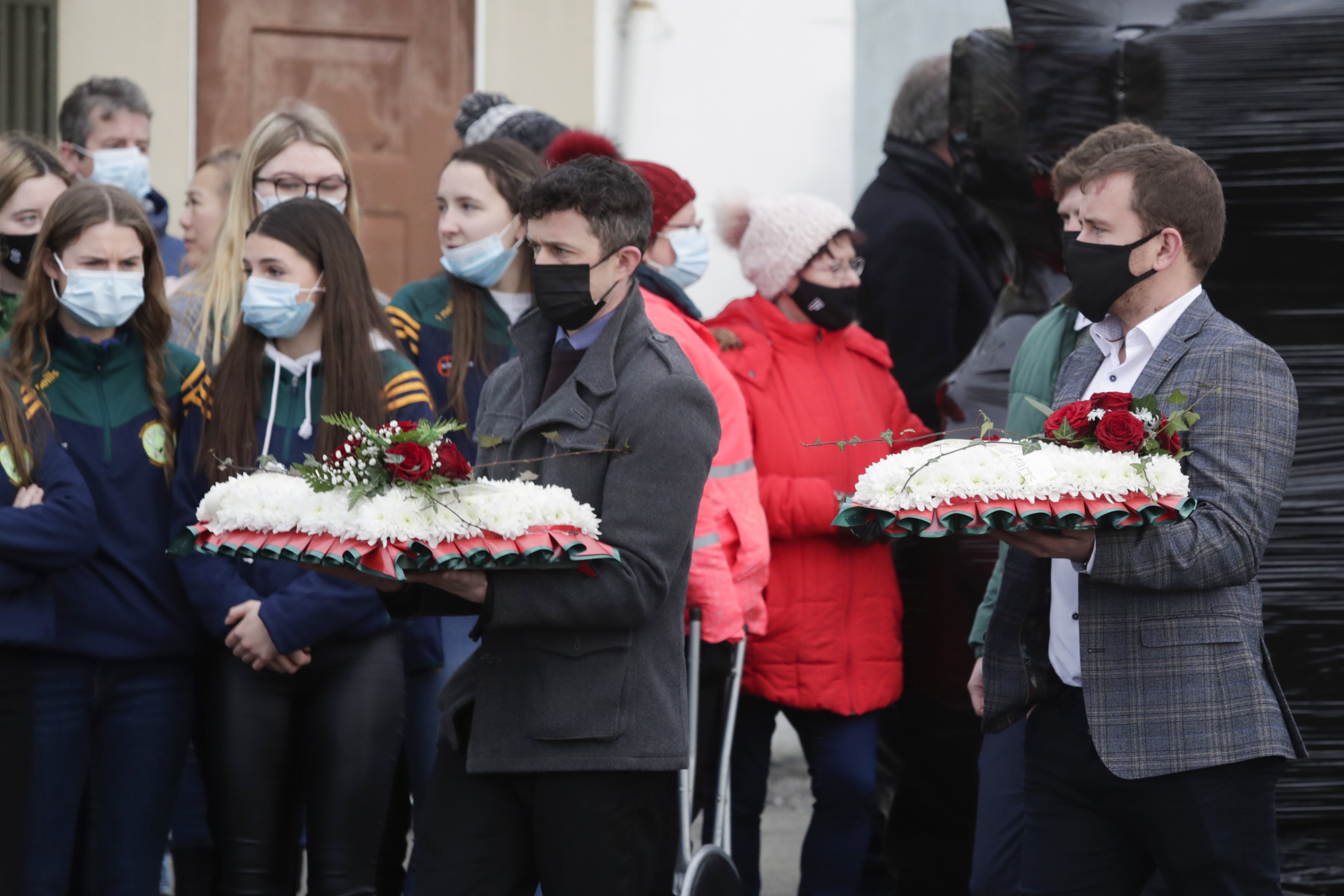 Mourners arrive with flowers at St Brigid’s Church, Mountbolus, Co Offaly, for the funeral of Ashling Murphy (Damien Eagers/PA)