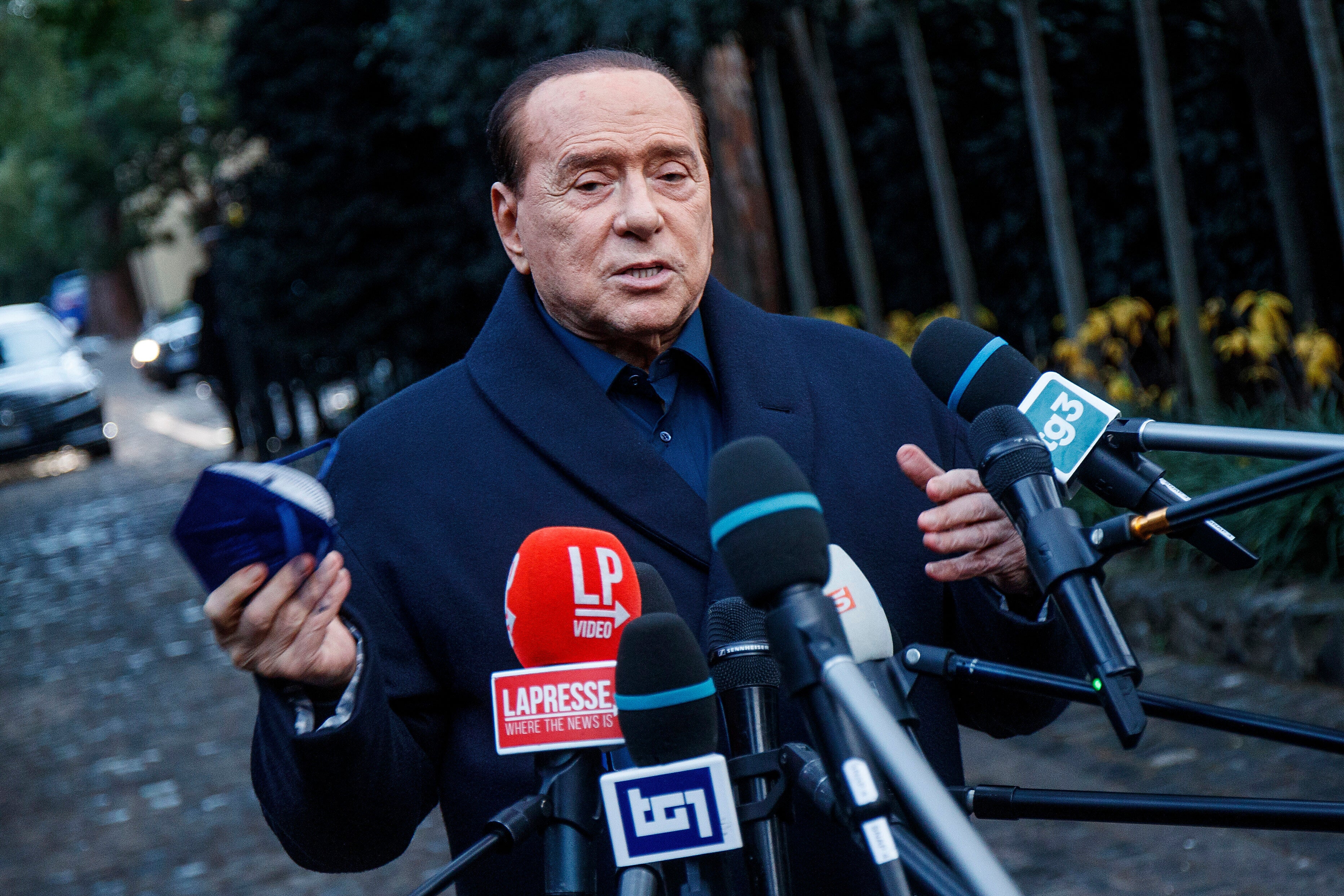 Silvio Berlusconi speaks to media following a meeting with center-right leaders in Rome, in December