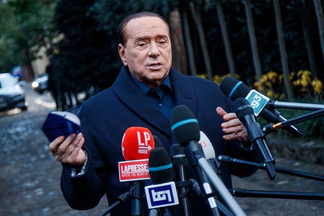 <p>Silvio Berlusconi speaks to media following a meeting with center-right leaders in Rome, in December</p>