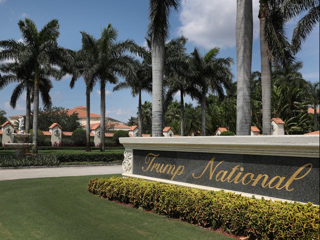<p>A sign is seen near the entrance to the Trump National Doral golf resort on April 20, 2020 in Doral, Florida</p>