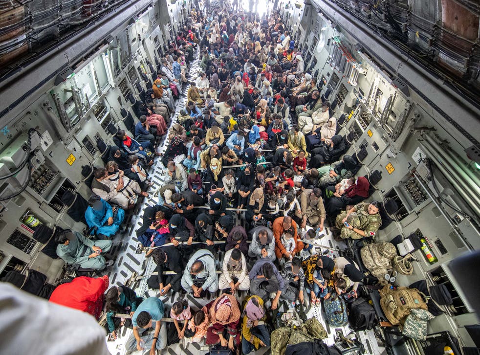 A full flight of 265 people supported by members of the UK Armed Forces on board an evacuation flight out of Kabul airport (MoD)