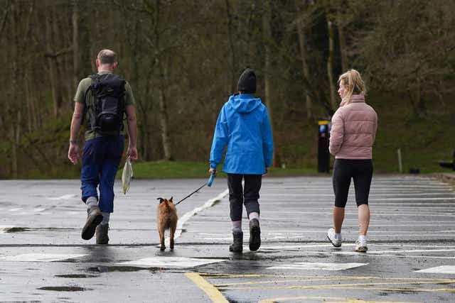 <p>Representative: A local family walk their dog in Yorkshiireon 28 March 2020</p>