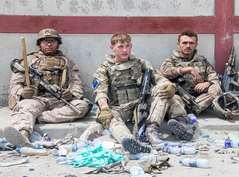 Members of the British and US (left) military engaged in the evacuation of people out of Kabul (MoD/PA)