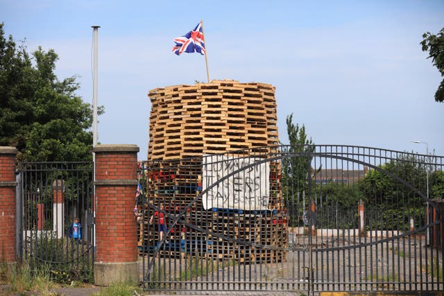 Two ministers launched legal proceedings challenging the PSNI’s decision not to intervene to assist in the removal of a contentious ‘Eleventh Night’ bonfire in the loyalist Tiger’s Bay area of north Belfast (Peter Morrison/PA)