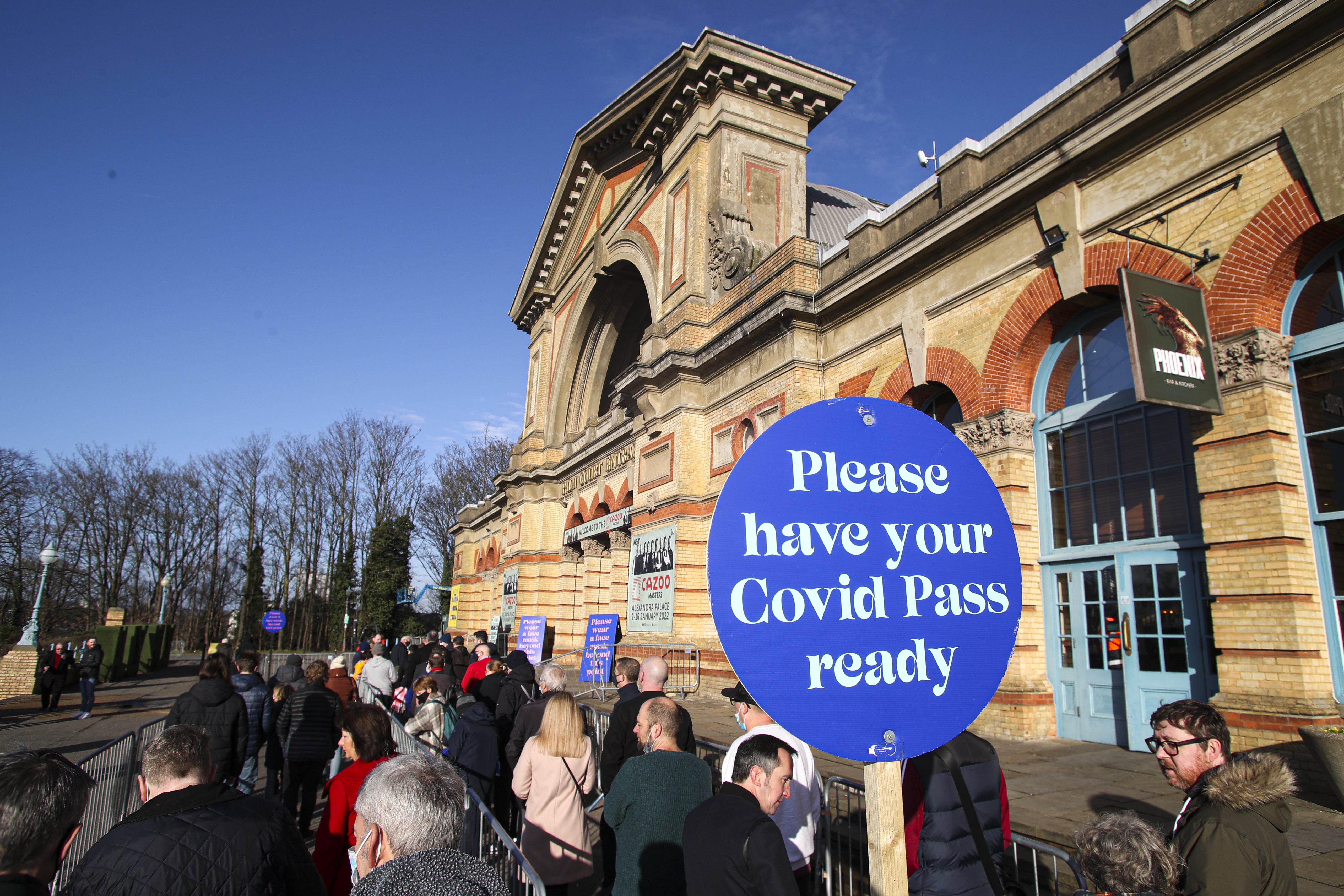 Spectators queue to show their Covid passes at the 2022 snooker Cazoo Masters at Alexandra Palace, London (Kieran Cleeves/PA)