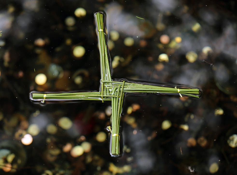A traditional St Brigid’s Cross made from rushes (Niall Carson/PA)