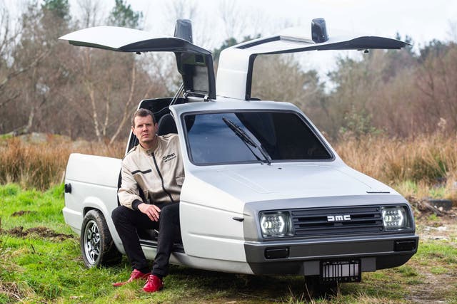 <p>Ty DeLorean pictured with his car at home near Newquay, Cornwall</p>