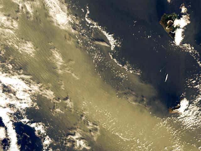 <p>Saharan dust flows past La Palma (top right) in the Canary Islands</p>