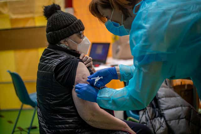 <p>File photo: A woman receives a Covid vaccine in Prague, Czech Republic, 18 March 2021</p>