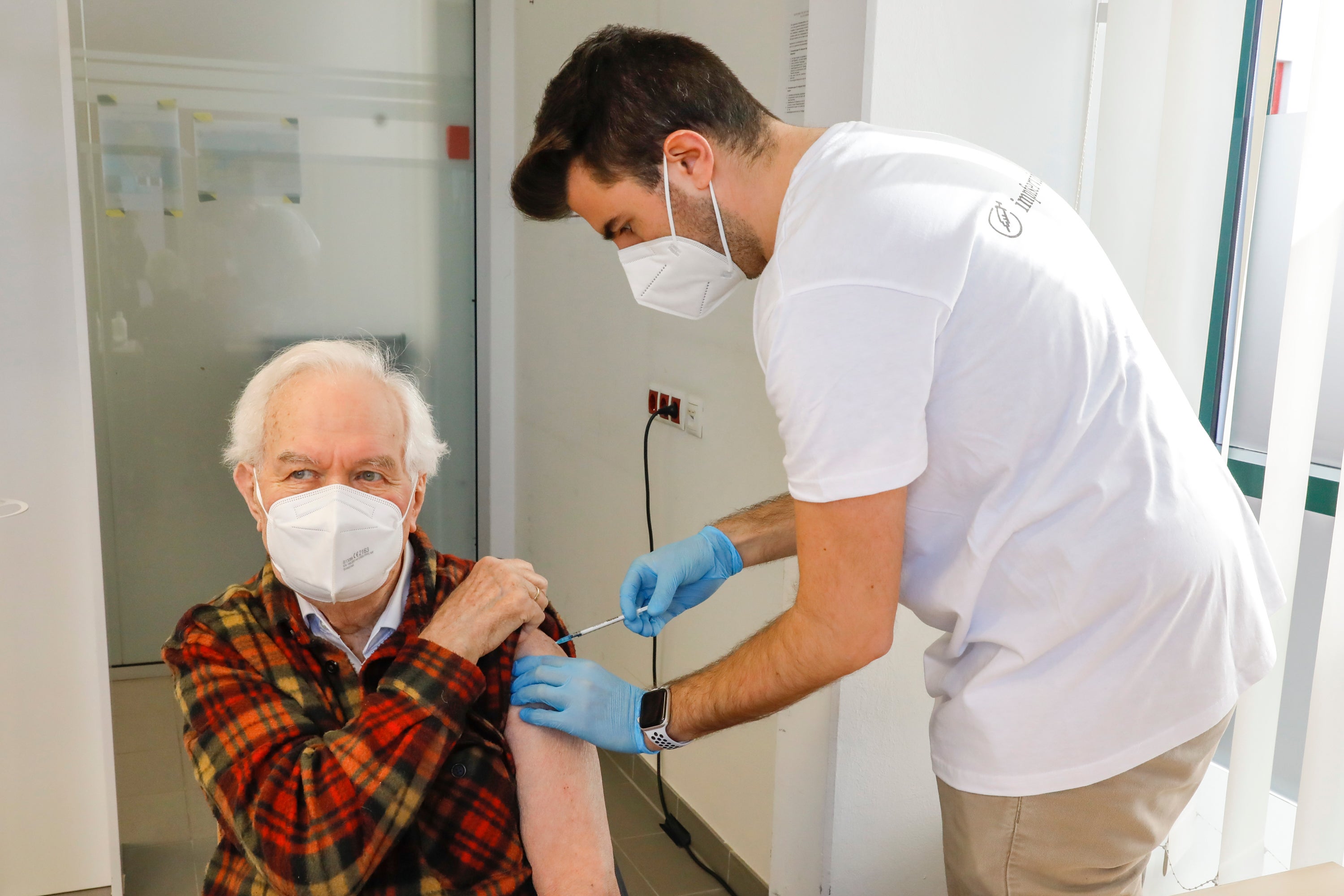 A man is vaccinated against the coronavirus in Vienna on 10 April, 2021