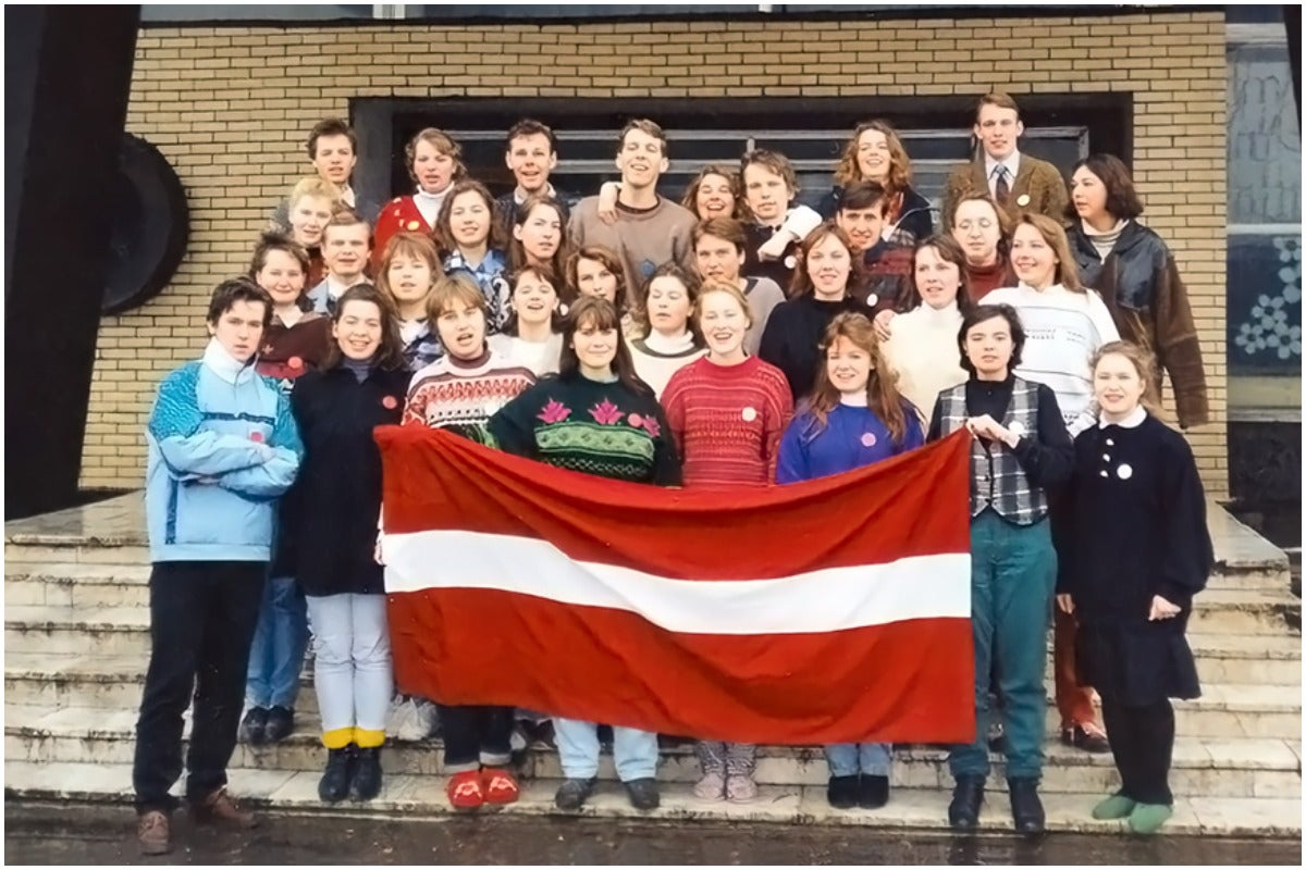Dr Urzula Glienecke as a teenager with other fellow activists holding the Latvian flag, which was banned under communist rule (Church of Scotland/PA)
