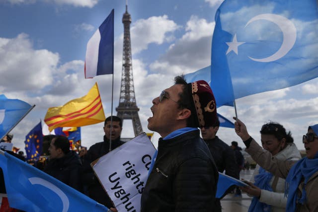 <p>File photo:  A protester of the French Uyghur Community shouts slogans during a demonstration over China’s human rights record in Paris, France, 25 March 2019 </p>