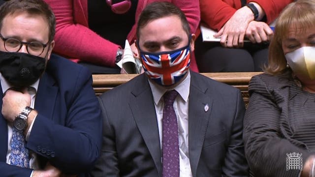 <p>Bury South MP Christian Wakeford sits on the opposition benches during Prime Minister’s Questions after deflecting to Labour </p>