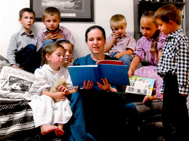 <p>Sasha Krause, pictured here reading to children, was murdered in early 2020</p>