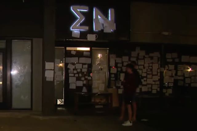 <p>Outside the Sigma Nu fraternity in October 2021 after protests </p>