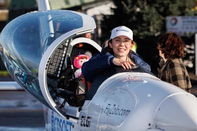 <p>19 year-old Zara Rutherford exits her two-seater airplane after completing her round-the-world trip </p>