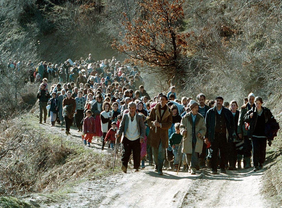 <p>A line of ethnic Albanian refugees flee on a small road in the mountains near Kacanik, about 60km south of Kosovo's capital, Pristina, March 1999</p>