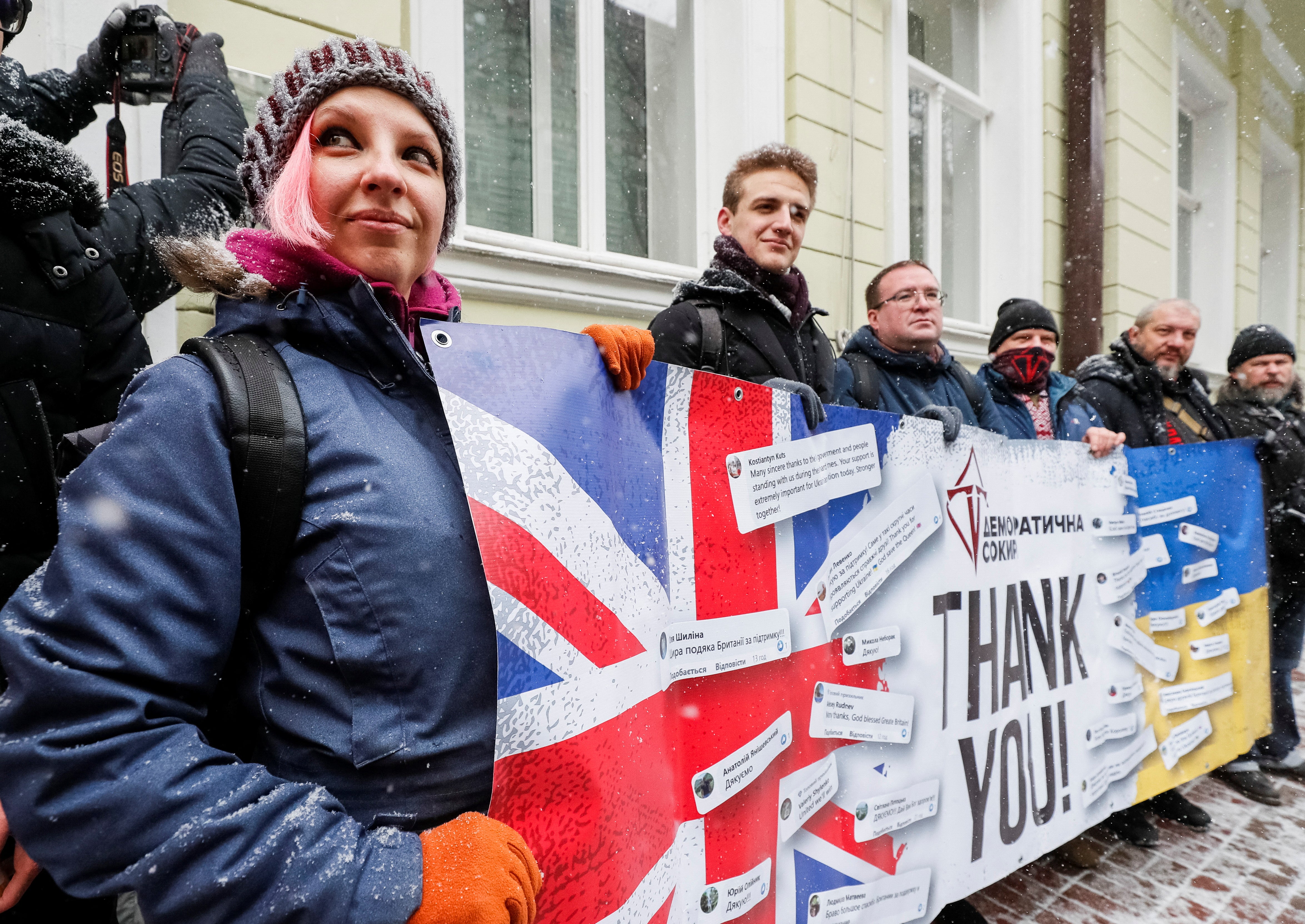 Members of the “Democratic Axe” political party take part in a rally to thank Britain for supplying Ukraine with anti-tank weapons in front of the British embassy in Kiev
