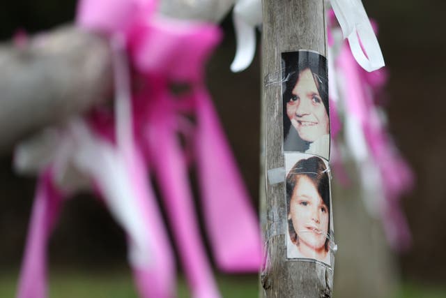 Photographs of Nicola Fellows (top) and Karen Hadaway near their memorial tree in Wild Park in Brighton, East Sussex, where their bodies where found together (Gareth Fuller/PA)