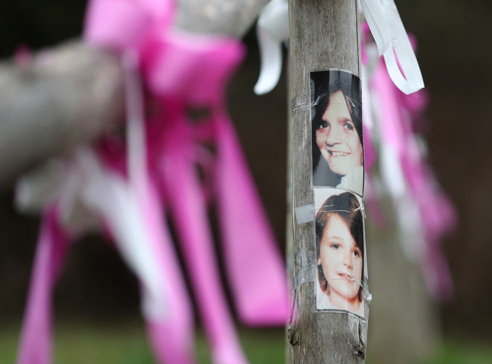 Photographs of Nicola Fellows (top) and Karen Hadaway near their memorial tree in Wild Park in Brighton, East Sussex, where their bodies where found together (Gareth Fuller/PA)